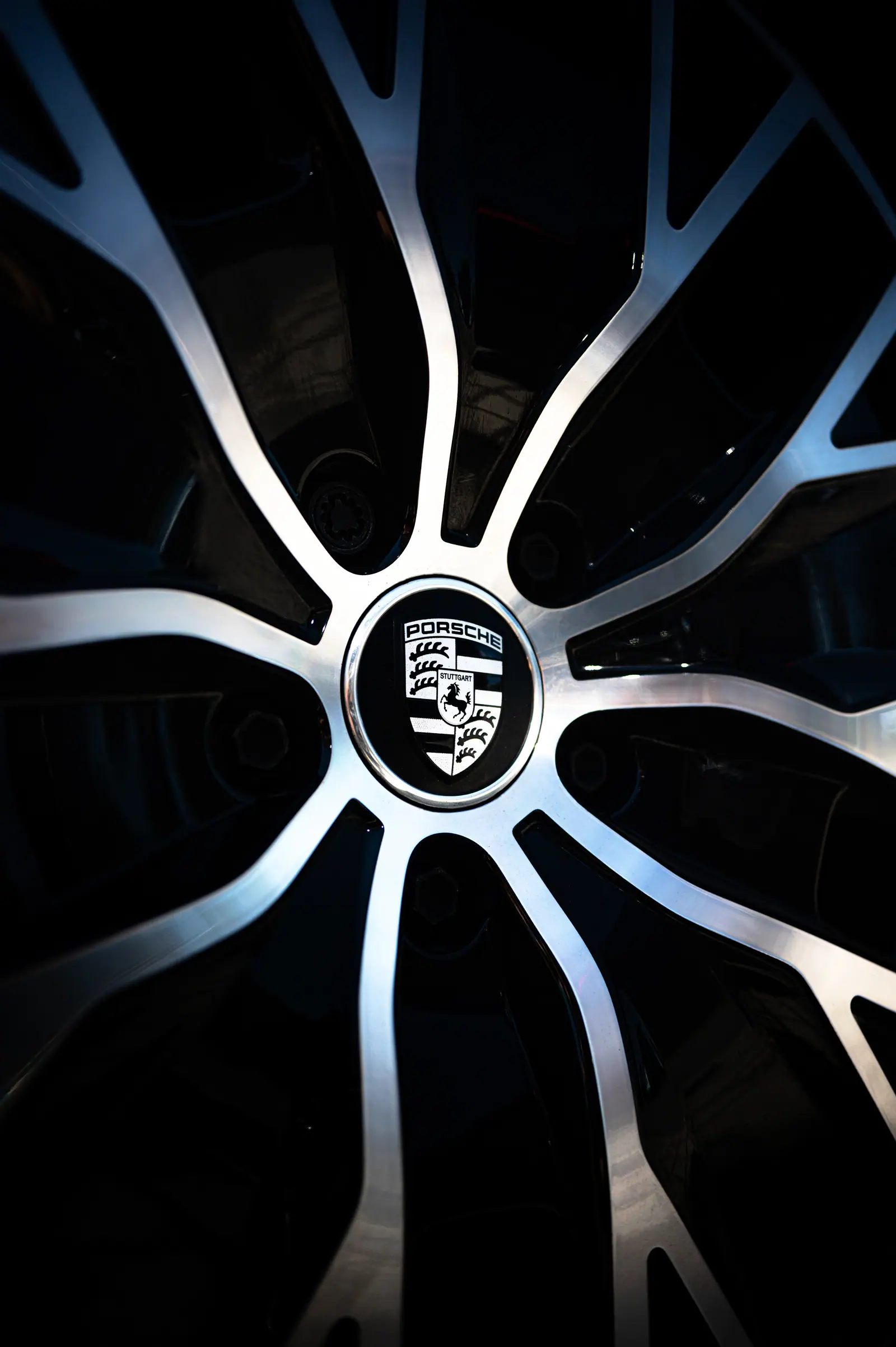 Porsche crest at the centre of a silver alloy wheel